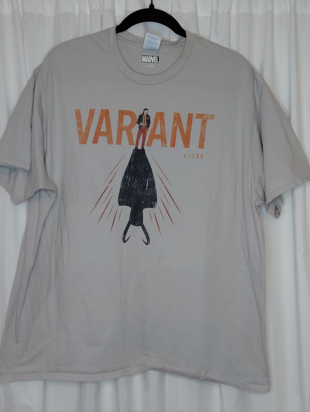 Marvel Cream Tee with Orange VARIANT Lettering and Black Silhouette